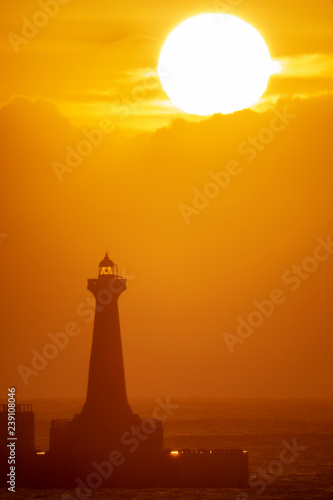 Sun rises behind lighthouse of Hualien, Taiwan