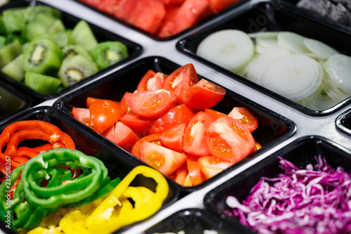 Canvas Print Fresh Vegetables and Fruits sliced in Salad Bar buffet