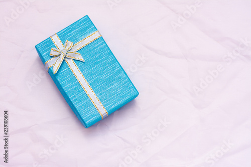 blue gift box with bow on white background