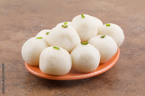 Indian Sweet Rasgulla Also Know as Rosogolla, Roshogolla, Rasagola, Ras Gulla, Anguri Rasgulla or Angoori Rasgulla is a Syrupy Dessert Popular in India. It is Made From Ball Shaped Dumplings photo