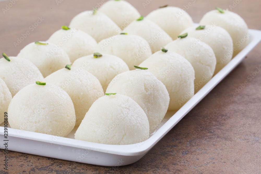 Indian Sweet Rasgulla Also Know as Rosogolla, Roshogolla, Rasagola, Ras Gulla, Anguri Rasgulla or Angoori Rasgulla is a Syrupy Dessert Popular in India. It is Made From Ball Shaped Dumplings