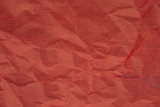 creased red wrapping paper background texture