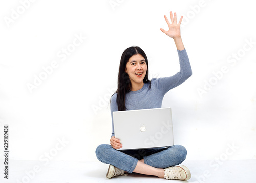 woman sitting floor holding laptop
