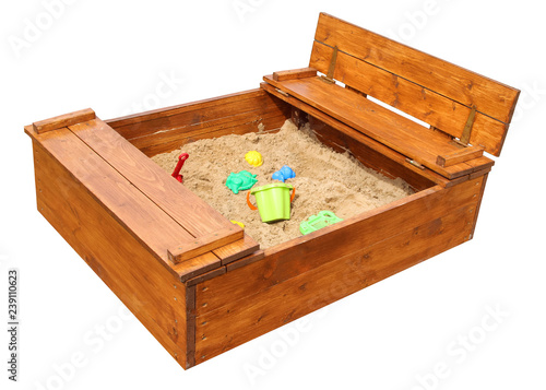 Schilderij op canvas Wooden children’s sandbox with toys. Isolated on white background