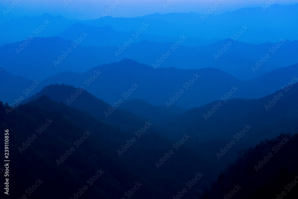 Layers of blue color mountains during sunset Layers of blue color mountains during sunset