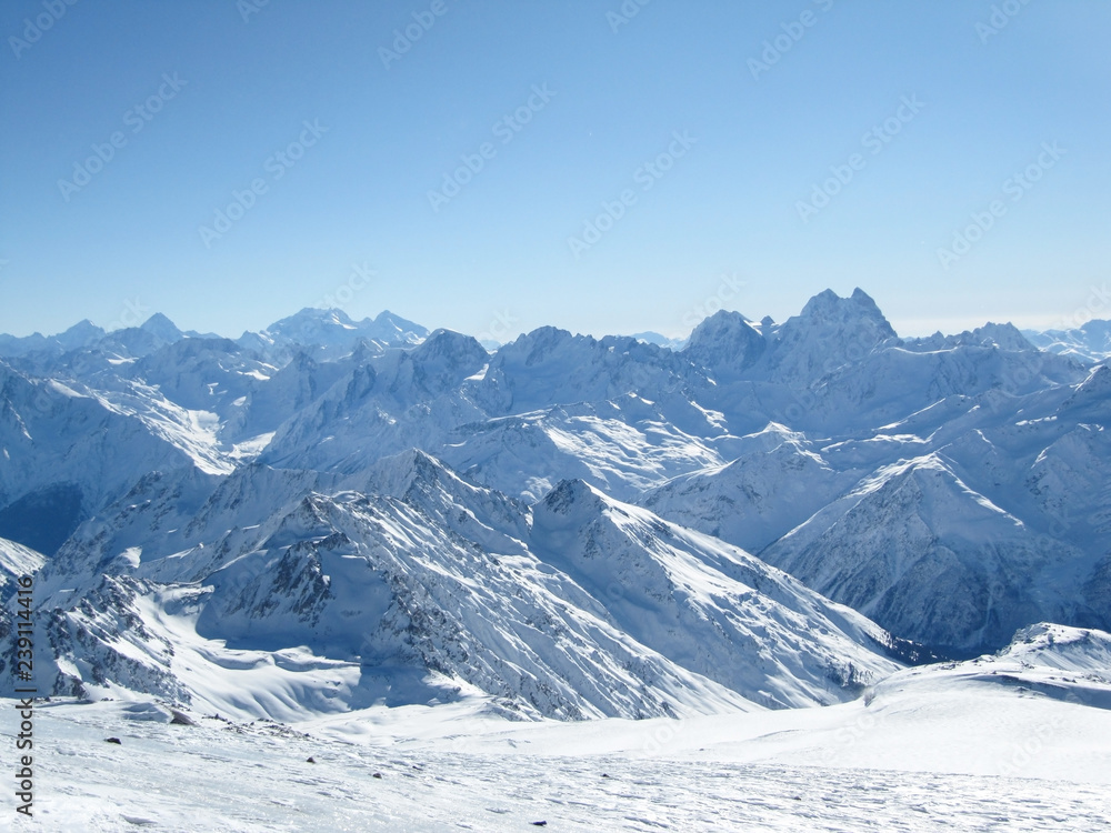 Beautiful snow-covered mountain range bright Sunny day
