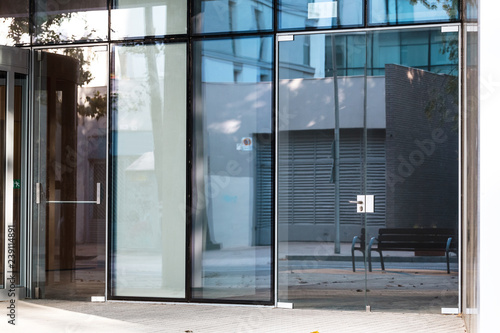 Fotografie Modern glass entrance of an office building