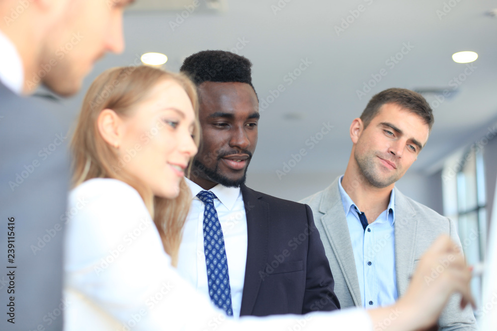 Business people team at presentation working with charts and diargams at flipchart. Business people team at presentation working with charts and diargams at flipchart.