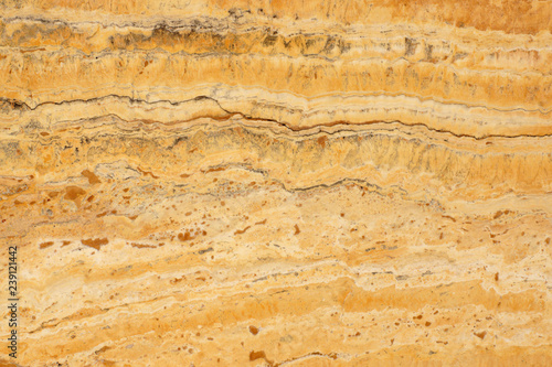 A natural stone, a polished yellow marble called Travertino Giallo