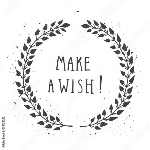 Vector hand drawn illustration of text MAKE A WISH! And floral round frame with grunge ink texture.