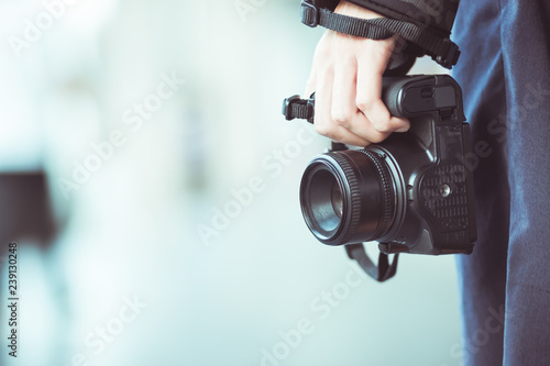 Professional photographer landscape with dslr camera in smart woman hands for ready to take pictures, Photographers takes snapshots for pleasure to remember events, vintage tone photo