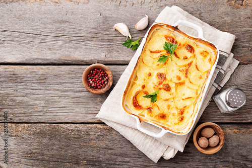 Potato gratin, backed potato slices with creamy sauce. photo