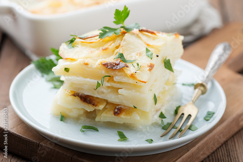 Potato gratin, backed potato slices with creamy sauce.