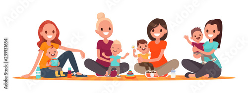 Group of mothers with babies. Club of young mothers. Mommies are sitting with children