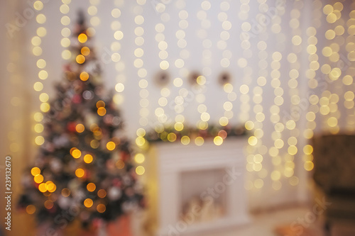 Christmas tree and holiday decorations. Blured defocused background