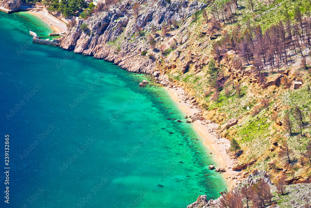 Emerald hidden beach under Biokovo mountain cliffs aerial view