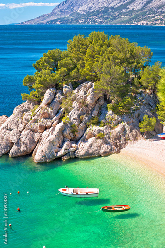 Idyllic emerald beach and boats in Brela aerial vertical view © xbrchx