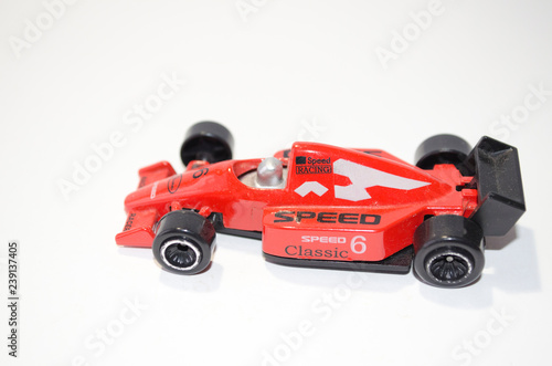 red toy race car on white background