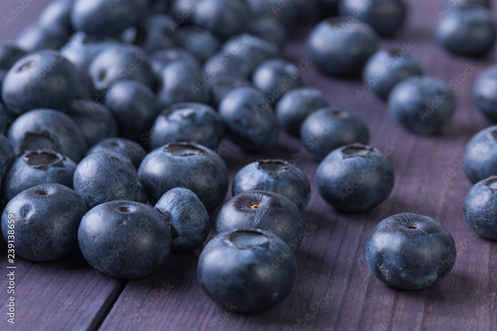Fresh blueberry on rustic wooden table. Ripe berry background. Healthy food concept. Angle view Fresh blueberry on rustic wooden table. Ripe berry background. Healthy food concept. Angle view