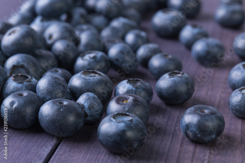 Fresh blueberry on rustic wooden table. Ripe berry background. Healthy food concept. Angle view