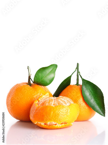 collection of mandarin peel and whole clementine or tangerine. concept of cleaning peel citrus