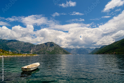 boat on the background of the mountains in montenegro
