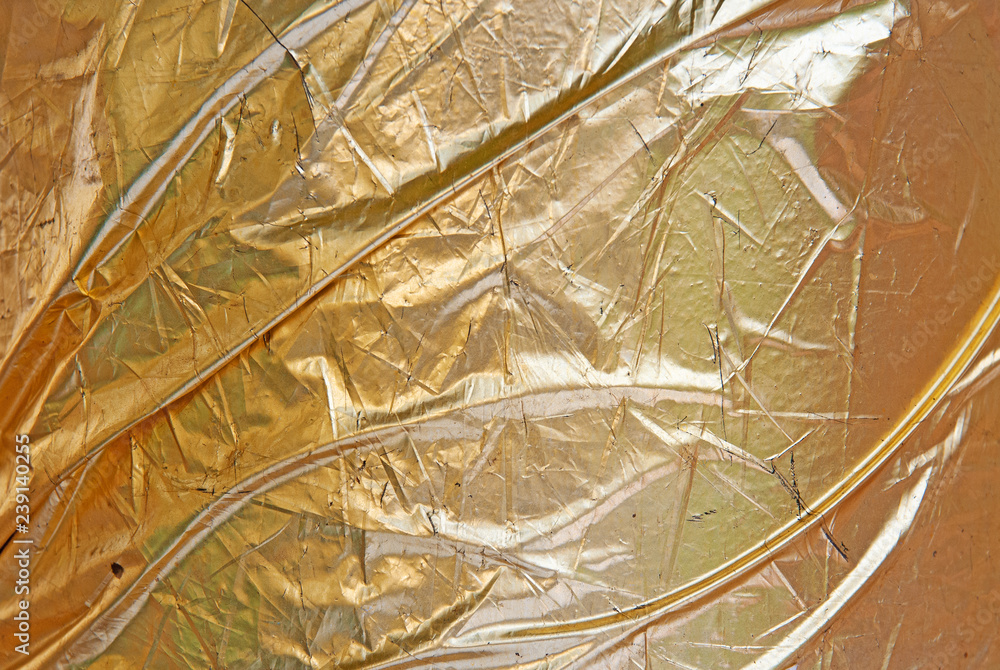 Φωτογραφία Gold leaf crumpled scratched uncommon texture.