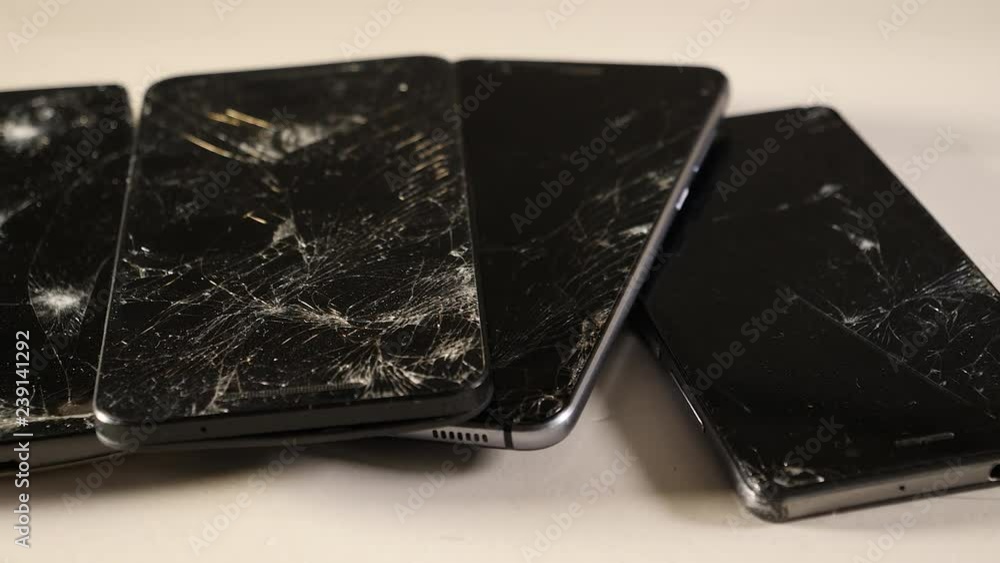 A number of broken smartphones. Slider shot. A number of broken smartphones. Slider shot.