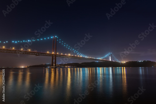 Night view of Lisbon and of the 25 de Abril Bridge, Portugal