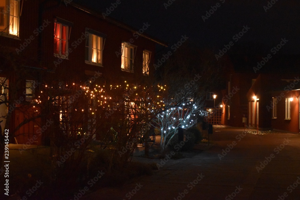 windows of apartment building at night with christmas decoration in Sweden