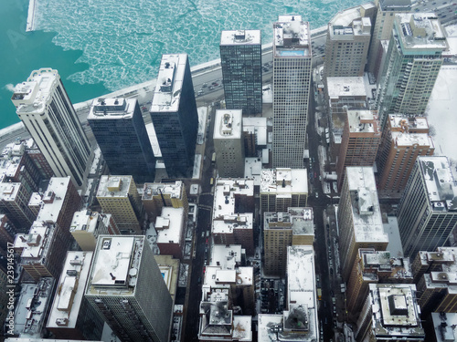 Aerial view of skyscrapers and city of Chicago, Illinois, USA. Winter urban landscape, during a snowstorm in Christmas of 2017 photo