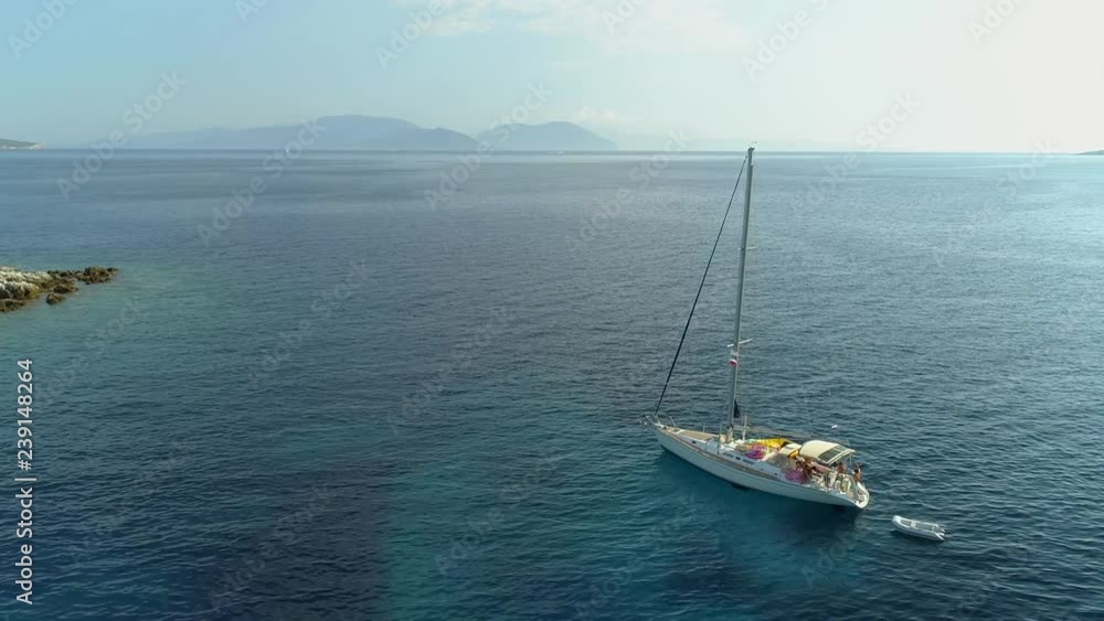 Aerial view of sailboat anchored in the mediterranean sea, Nisi, Greece. Aerial view of sailboat anchored in the mediterranean sea, Nisi, Greece.