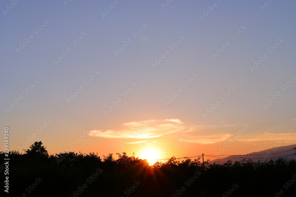 orange sun light on beautiful sunset clear blue sky background
