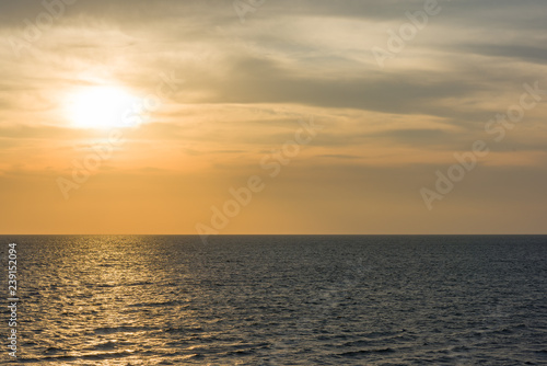Bright gold solar path in the sea at sunset © Сергей Илюхин
