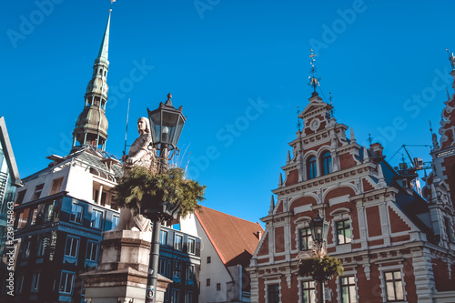 View on Roland Statue, The Blackheads House and St Peter church. Old City center of Riga, The Town Hall Square. October 25, 2018.