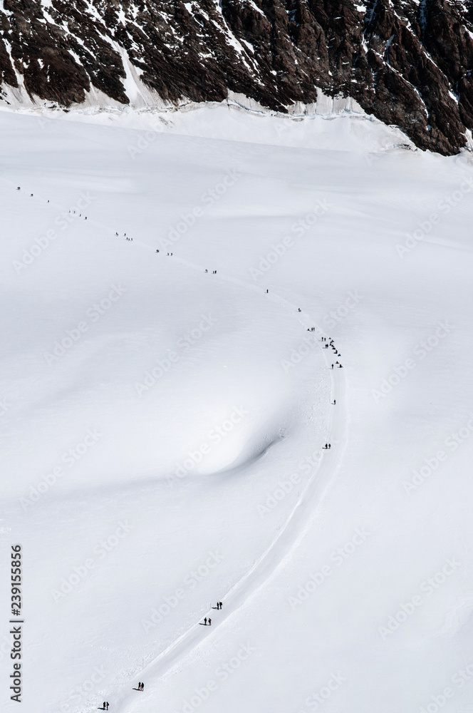 Obraz premium Tourist on winter landscape of Jungfraujoch, top of Europe Swiss alps scenery..
