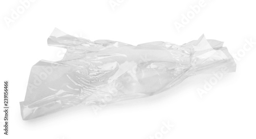 Crumpled transparent candy wrapper on white background