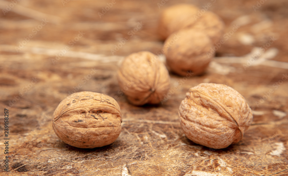 Walnuts on a marble table on the table Walnuts on a marble table on the table