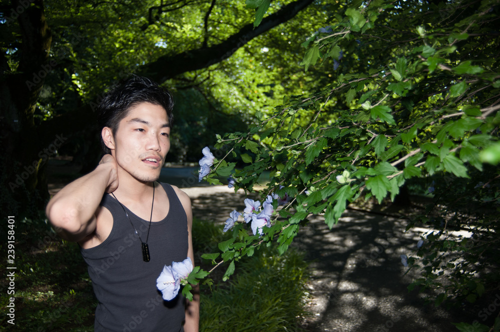 Asian male model poses for pictures on the street Asian male model poses for pictures on the street
