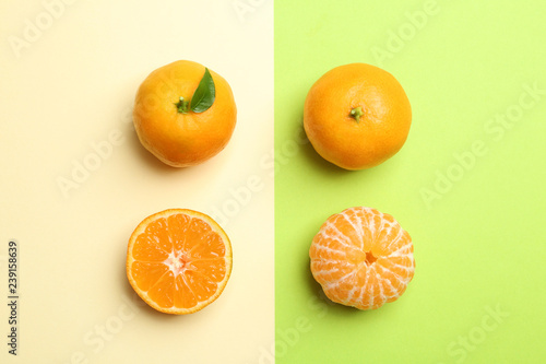 Flat lay composition with fresh juicy tangerines on color background