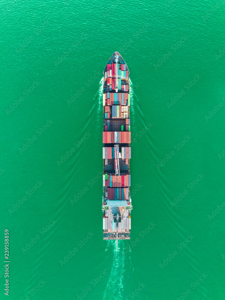 Aerial top view container ship on the sea full speed transport container for logistics import export or shipping background. Aerial top view container ship on the sea full speed transport container for logistics import export or shipping background.
