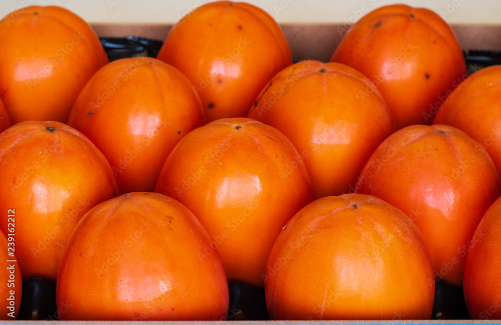  closeup of persimmon fruit  in the box