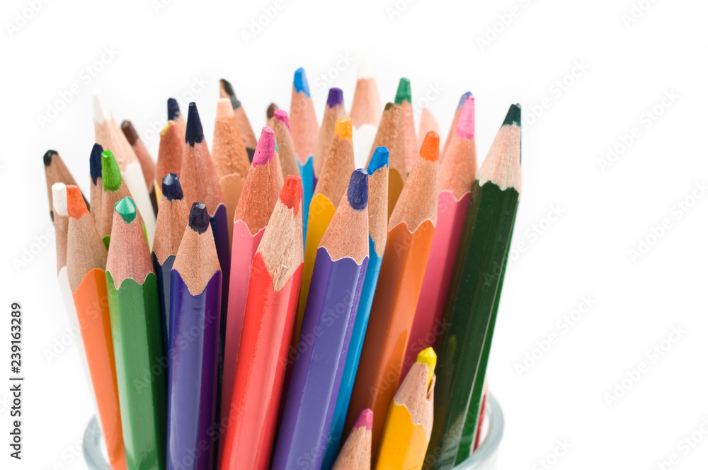 Bunch of colored pencils isolated on white background. Selective focus. Bunch of colored pencils isolated on white background. Selective focus.