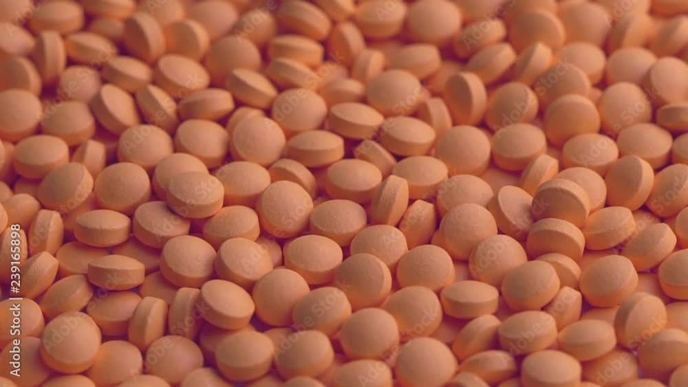 Close up orange drug spin,slow motion Close up orange drug spin,slow motion