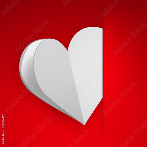 Big white heart inserted into a cutout in a sheet of red paper