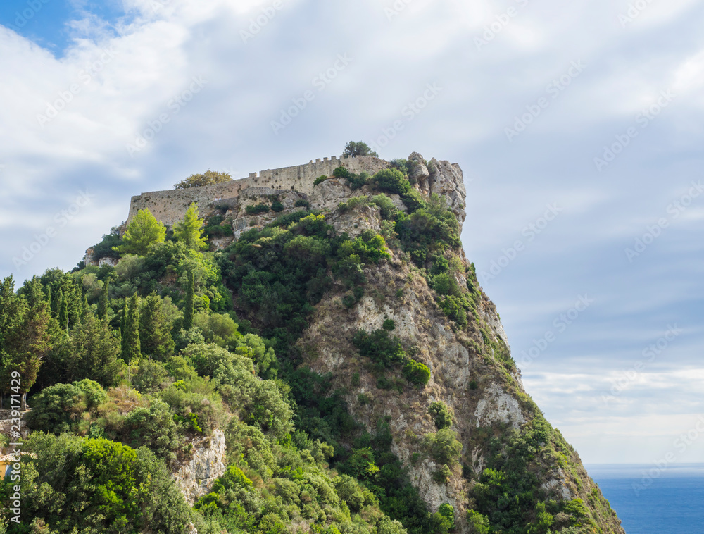 Aerial view of iconic medieval fortified castle of Angelokastro with amazing views, known as Angel Castle close to Paleokastritsa, summer cloudy day, Corfu Greece