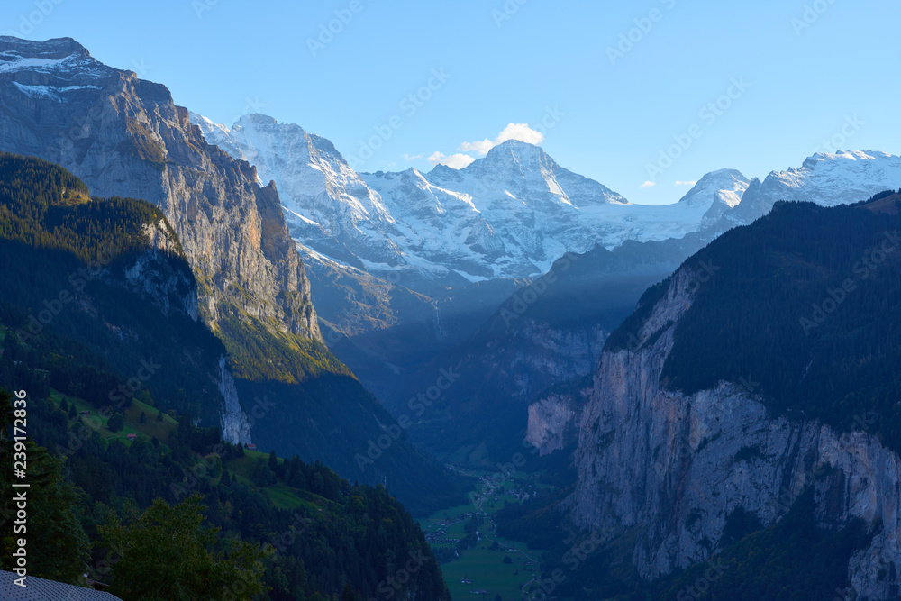 Evening dramatic view of Lauterbrunnen valley from Wengen mountain village in Switzerland.