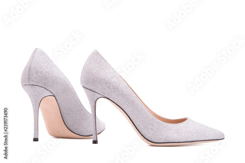 Silver high-heeled shoes. Female shoes on a white background.