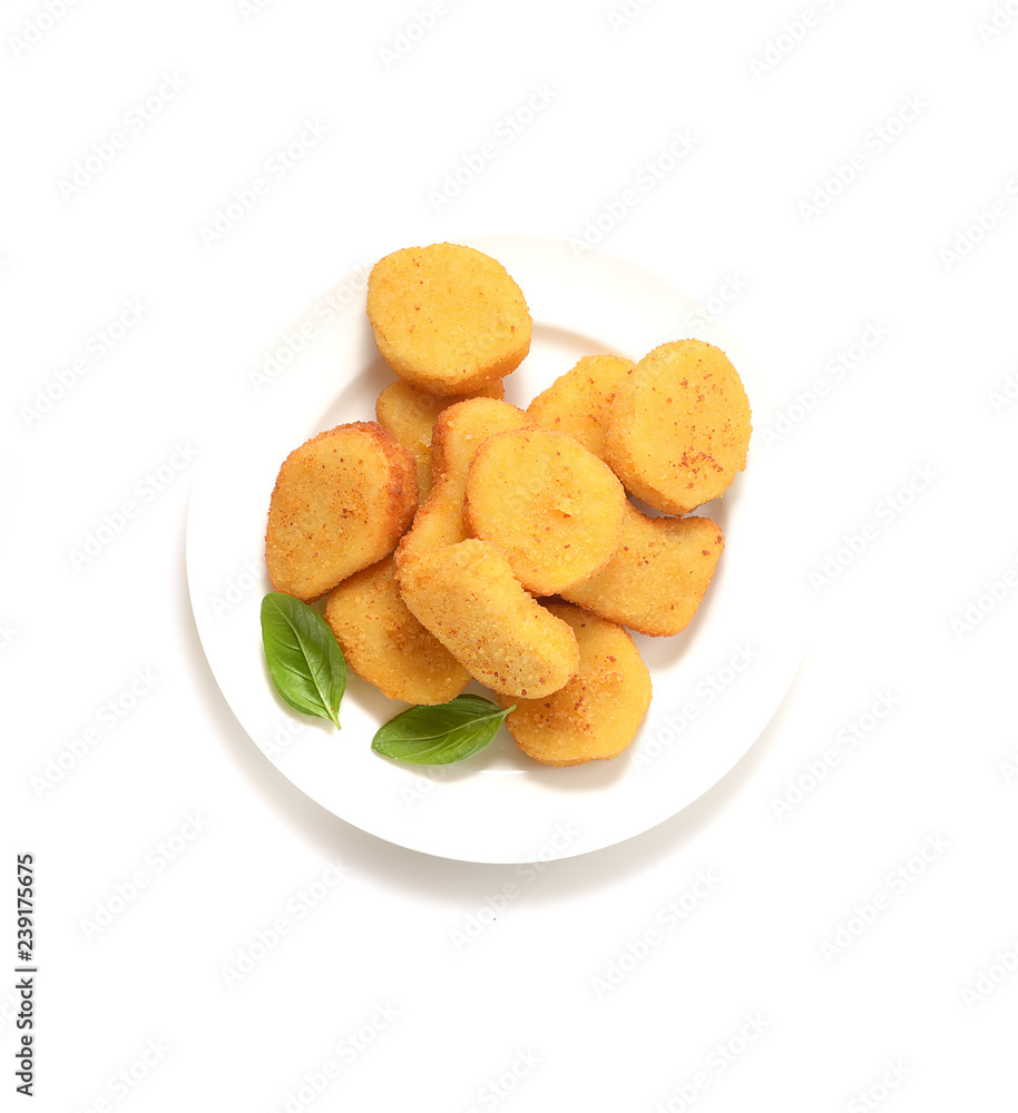 Fried chicken nuggets with basil leaves on a white background.Top view. Fried chicken nuggets with basil leaves on a white background.Top view.