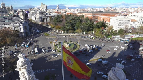 Aerial and panorama view of city rush traffig in Cibeles fountain at Plaza de Cibeles. Cibeles Fountain is an iconic place of Madrid City. Spain photo